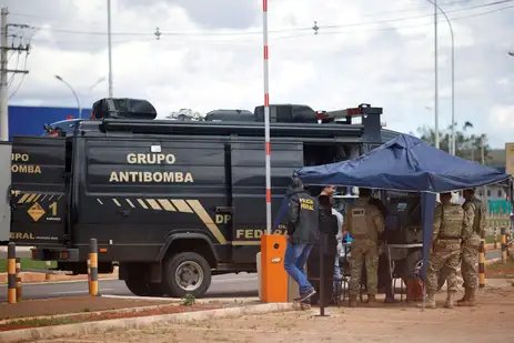 Security forces work as a robot of the federal police bomb squad is seen near what is believed to be an explosive artifact in Brasilia, Brazil, December 24, 2022. REUTERS/Adriano Machado